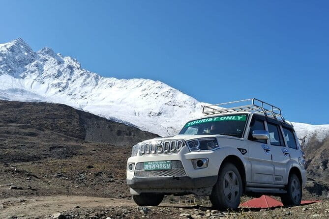 "Exclusive Round-Trip Transfer: Pokhara to Jomsom & Muktinath" - Villages, fields, rivers, and mountain views