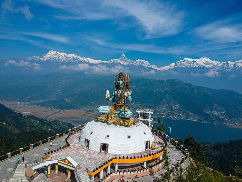 Pokhara: City Sightseeing Group Bus Tour - Pumdikot Shiva Statue begins the day with a high view